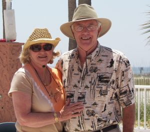 Kay and Jim in hats on the beach